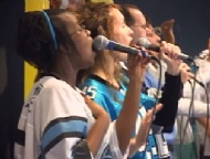 Church members sing hymns while wearing their favorite teams' jerseys.